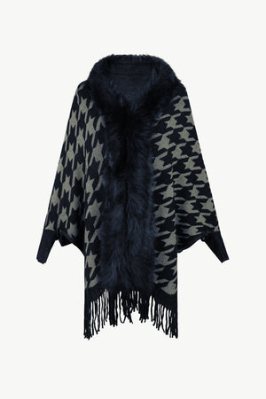 Houndstooth faux fur collar poncho with fringe detail in beige and black.