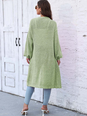 Light green ribbed knit maxi cardigan with pockets and balloon sleeves.