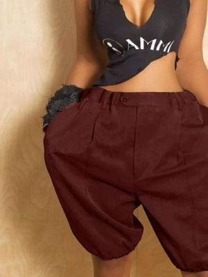 Burgundy pleated high-waisted shorts with drawstring and balloon leg