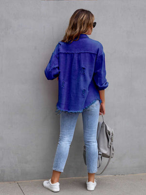 Royal blue distressed denim shacket with frayed hem and cuffs.