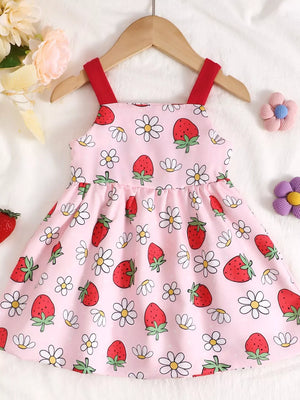 Pink strawberry and daisy print baby dress with red straps