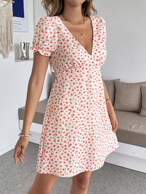 Floral V-neck puff sleeve mini dress with a red floral print on a white background.