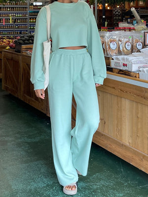 Aqua waffle knit cropped lounge set with wide leg pants and long sleeves.