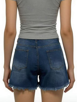 Dark blue denim shorts with frayed hem and distressed details.