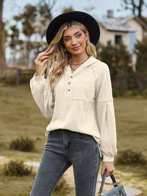 Cream textured knit henley with balloon sleeves and button detail