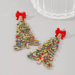 Festive rhinestone Christmas tree dangle earrings with red bows and colorful gems.