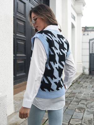 Houndstooth knit v-neck pullover vest in black and misty blue acrylic, styled over a white shirt.