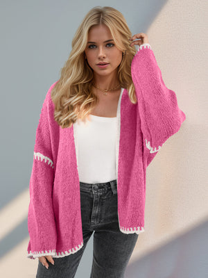 Hot Pink oversized knit cardigan with contrast white stitching detail.