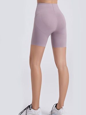 Lilac high-waist bike shorts with a sculpted contour detail on the back.