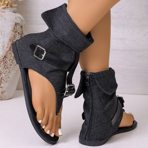 Denim ankle cuff sandals in black with buckle and zipper details.