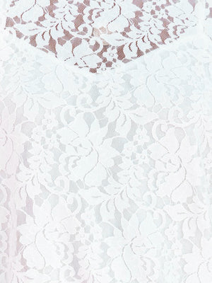 White lace short sleeve blouse with floral pattern and sheer overlay detail.