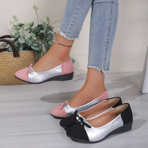 Pink and silver slip-on flats with bow detail, also shown in black.