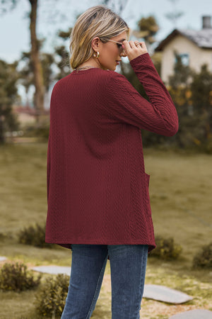 Burgundy textured open-front cardigan with pockets and long sleeves.