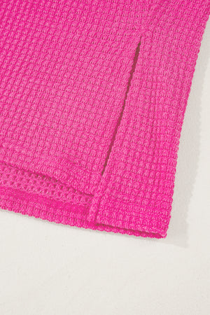 Hot pink waffle knit v-neck top with slit hem detail