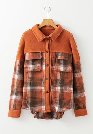 Colorblock plaid shacket in terracotta with contrast cuffs and chest pockets.