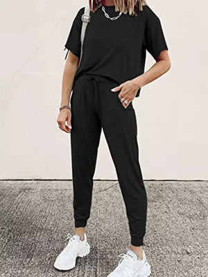 Black cotton round neck top and jogger pants set with drawstring waist.