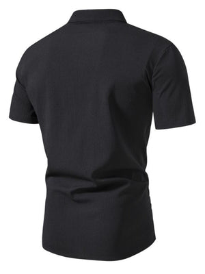 Men's black short sleeve button-up shirt with textured fabric and band collar.