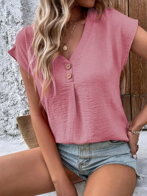 Blush pink textured cap-sleeve blouse with button front and v-neck