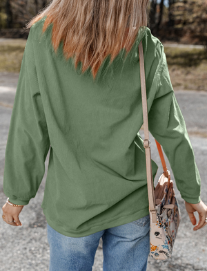 Sage corduroy sweatshirt with textured stripes and long sleeves.