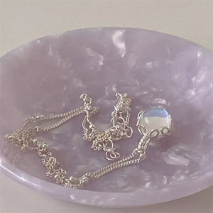 Luminous moonstone pendant necklace in 925 sterling silver with blue hues and a delicate chain.