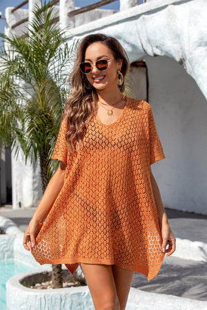 Open-knit orange beach poncho with v-neck and short sleeves, perfect for summer.
