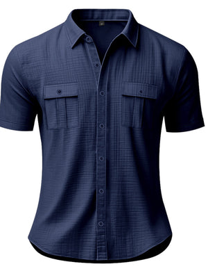 Navy blue short sleeve button-down shirt with two chest pockets and subtle texture.