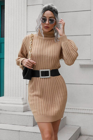 Camel ribbed turtleneck mini dress with puff sleeves and a wide jeweled belt.