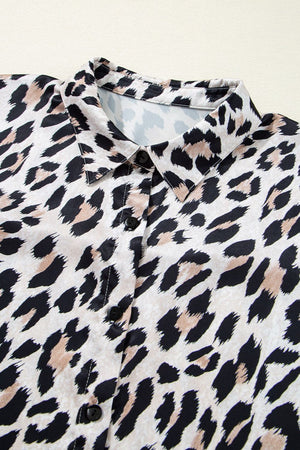 Leopard print oversized button-down blouse with black buttons and a collared neckline.