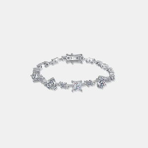 Silver geometric moissanite statement bracelet with assorted diamond cuts and sterling silver chain.