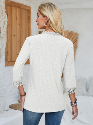White eyelet blouse with lace trim on neckline and 3/4 sleeves