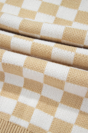 Tan and white checkerboard knit polo sweater with a textured fabric detail.