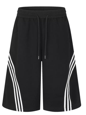 Black wide-leg cropped sweatpants with drawstring waist and white side stripe detail.