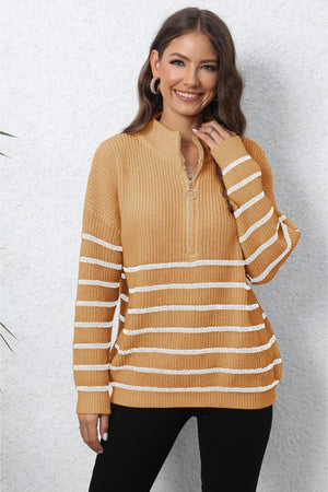 Striped ribbed knit quarter-zip sweater in tangerine with white horizontal stripes and a mock neck.