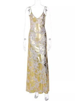 Maxi dress with abstract gold and cream pattern, V-neck, and spaghetti straps.