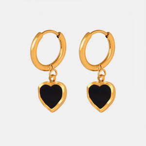 Gold hoop earrings with black enamel heart charms