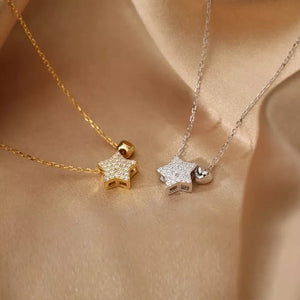 Celestial heart and star necklaces in white gold and gold with pave details.