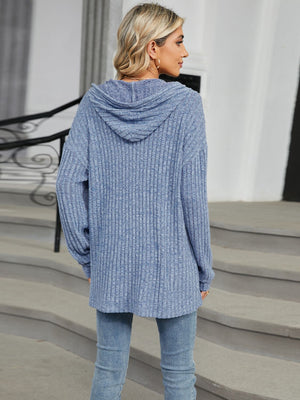 Ribbed knit hoodie in Dusty Blue with a drawstring hood and button detail.