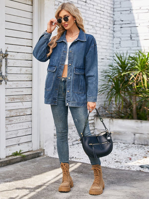 Denim button-up jacket in dusty blue with chest pockets and a relaxed fit.