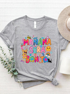 Gray graphic tee with "Mañana Sera Bonito" text and colorful cartoon illustrations.