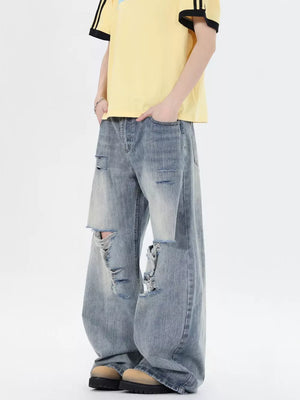 Men's light wash distressed wide-leg jeans, 100% cotton, relaxed fit.