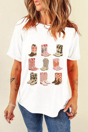 White t-shirt with a graphic print of nine different cowboy boots in various western motifs.
