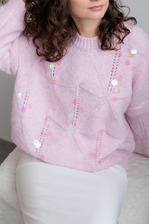 Blush pink diamond knit sweater with scattered iridescent sequins and open knit details.