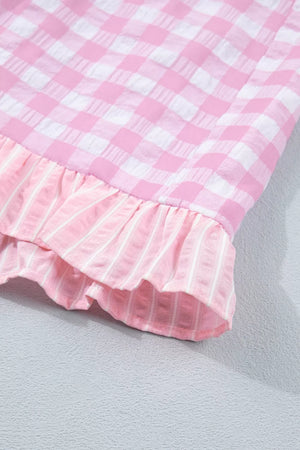 Charming gingham ruffle hemmed shorts in blush pink with striped ruffle detail.