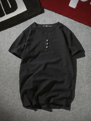 Black short sleeve buttoned shirt with V-neck and henley detail.