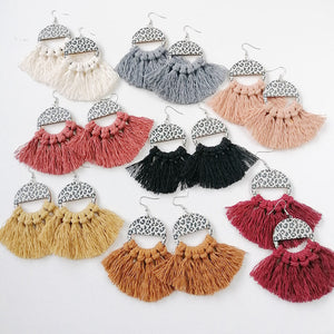 Leopard print tassel earrings in multiple colors, featuring a semi-circle top and fringe detail.