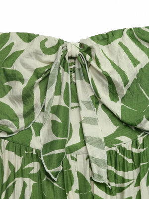 Tropical tie-front strapless maternity jumpsuit with green leaf print and tie detail.