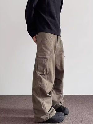 Men's brown cargo sweatpants with baggy fit and large side pockets.