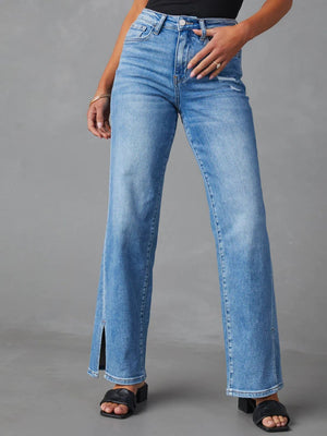 Medium wash split hem flare jeans with a button fly and distressed detail.