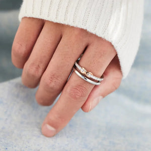 Silver infinity knot trio ring set with pave diamonds on one band