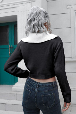 Black cropped acrylic sweater with white collar and zip detail